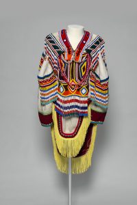 Unidentified artist.ˇAmautik, c. 1995.ˇwool duffle, glass beads, nylon fringe, cotton ribbon, cotton thread, and felt,ˇ150 x 90 cm.ˇCollection of the Winnipeg Art Gallery